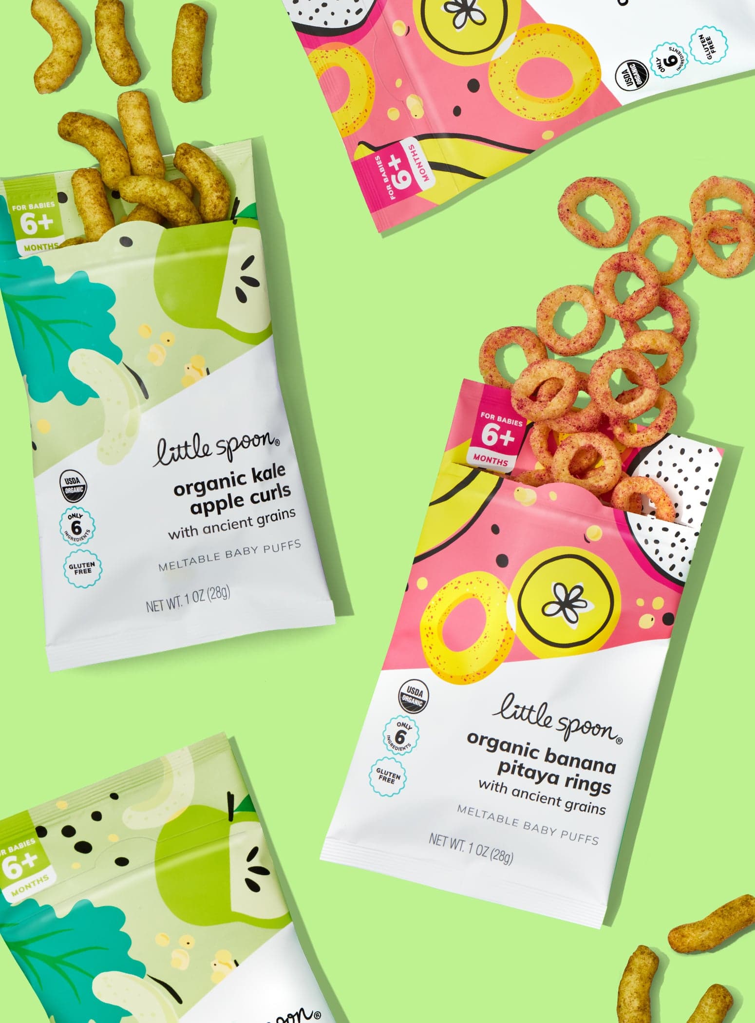 Opened bags of organic banana pitaya rings and organic kale apple curls puffs flavors and two closed bags organic banana pitaya rings and organic kale apple curls on a lime green background.